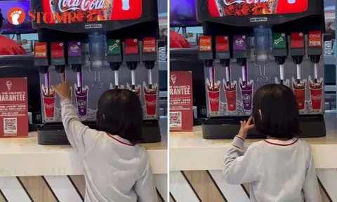 Girl licks fingers after sticking them in drinks machine at KFC Wisteria Mall