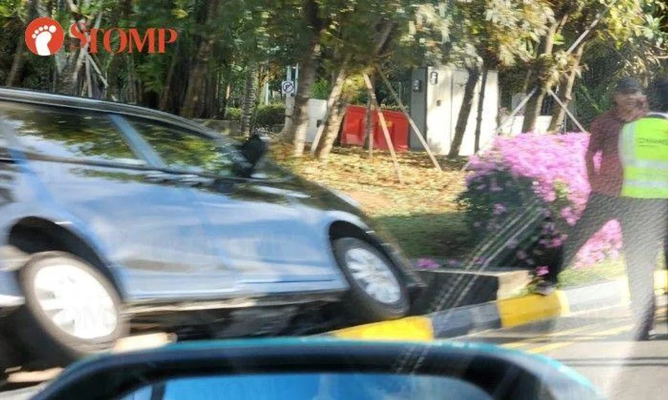 Stomper Grace shared a photo of the tilted vehicle with its two left wheels in the gutter.