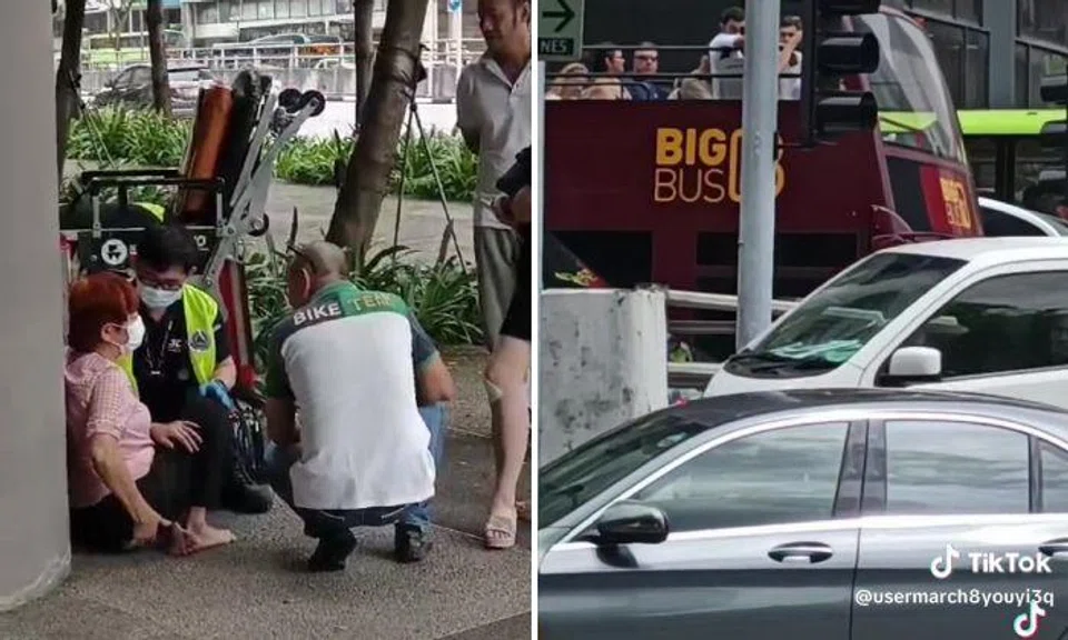 Aunty hurt in accident with Mercedes and taxi in Chinatown, tourists on passing bus get a look