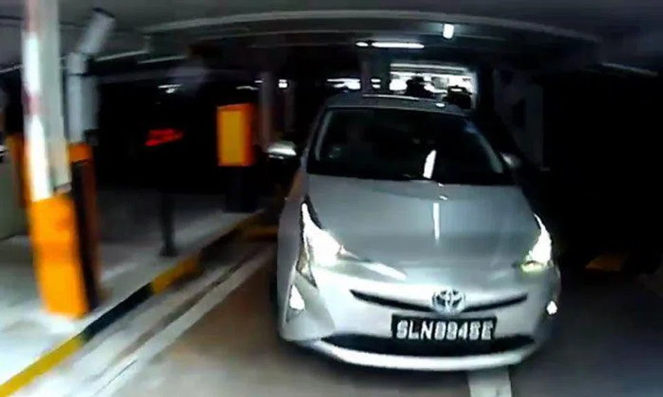Driver 'hides' in lot, then ninjas his way out of carpark by tailgating motorist