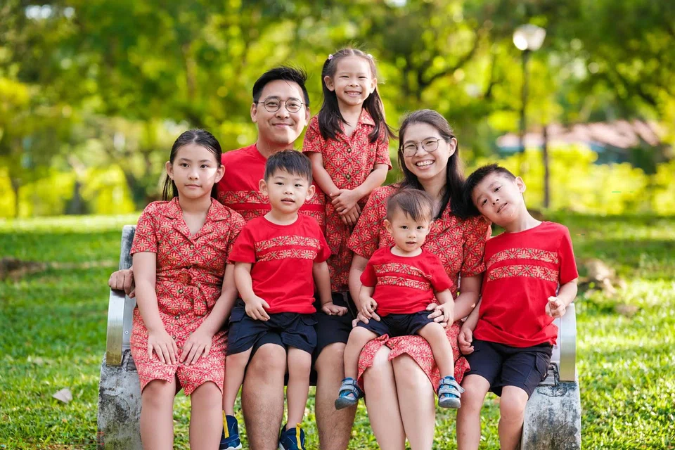 The Koh family with their children aged three, five, seven, nine and 11.