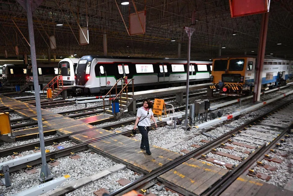 Train captain Munirah Zulkepli, 29, walking towards the train she is going to launch on the morning of March 11 from Bishan Depot.