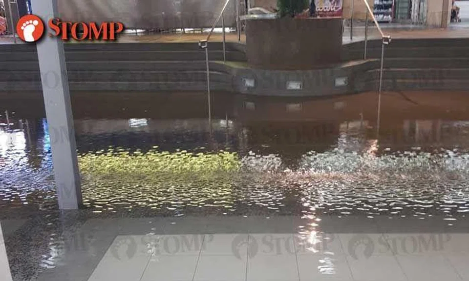 Walkway at Jurong West St 52 hit by ponding after rain