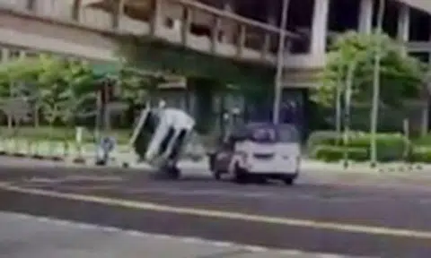 Car flips onto its side after driver beats red light and gets hit by van at Jurong