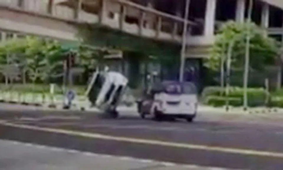 Car flips onto its side after driver beats red light and gets hit by van at Jurong