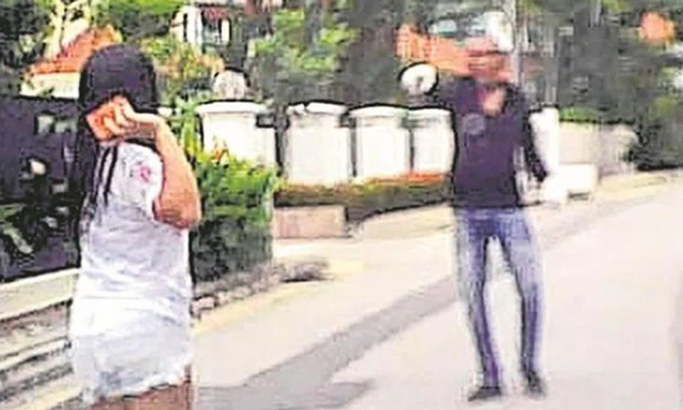 Photo: Lianhe Zaobao. The 30-year-old helper (left) and the suspect (right) The 30-year-old helper (left) and the suspect (right)