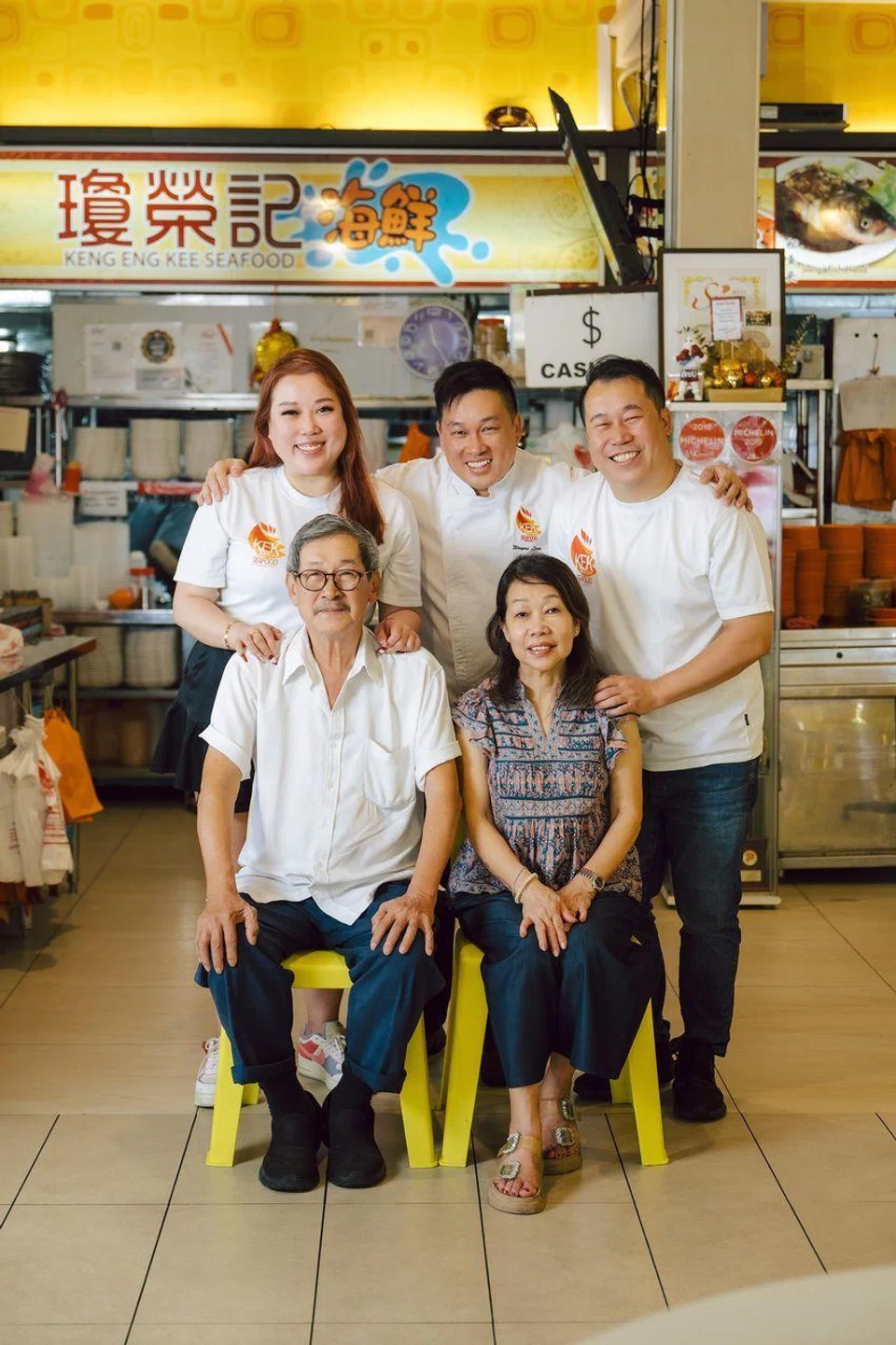 Keng Eng Kee Seafood's third-generation siblings that run the business (back row), with their parents (seated). 