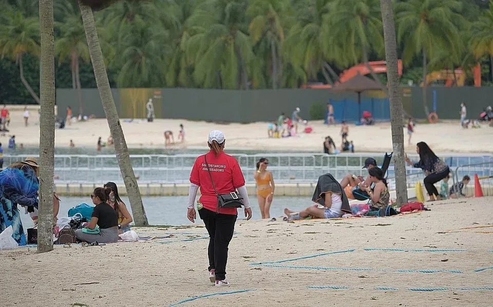Since July, the island's three beaches have been segmented into seven zones, each with a capacity limit ranging between 100 and 350 people. Visitors queuing to enter Palawan Beach.