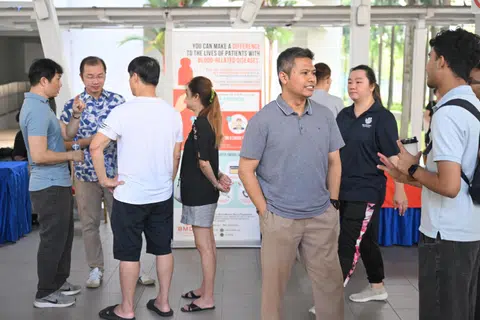 Potential WP candidate Abdul Muhaimin Abdul Malik (in grey shirt) seen at a Sengkang GRC townhall meeting on March 29 at the multi-purpose hall at Block 273E Compassvale Link.