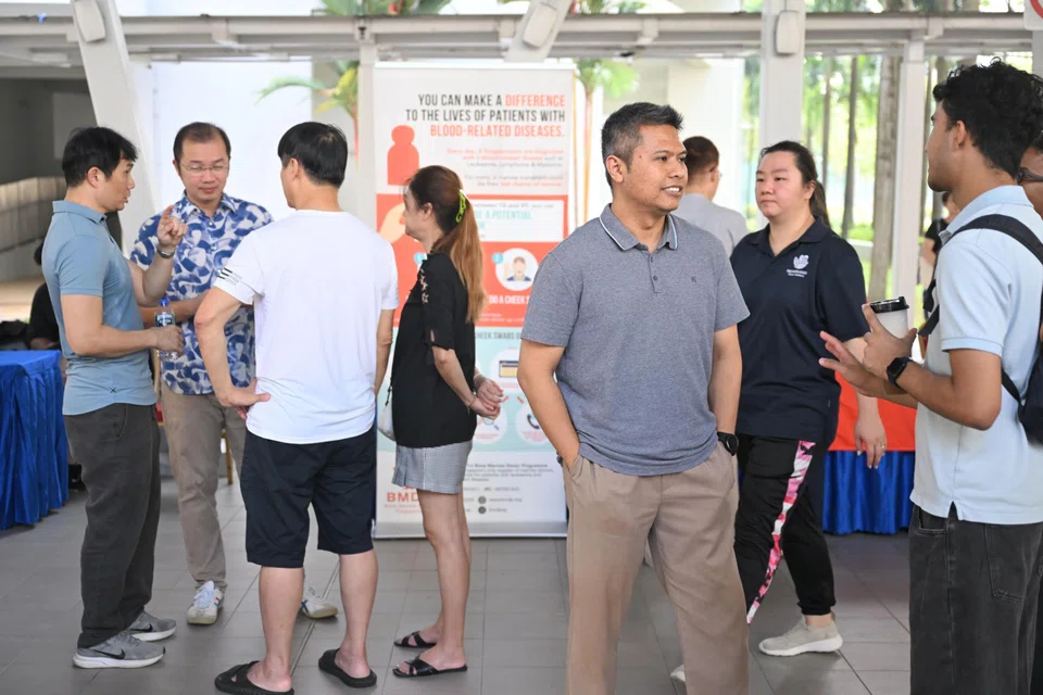Potential WP candidate Abdul Muhaimin Abdul Malik (in grey shirt) seen at a Sengkang GRC townhall meeting on March 29 at the multi-purpose hall at Block 273E Compassvale Link.