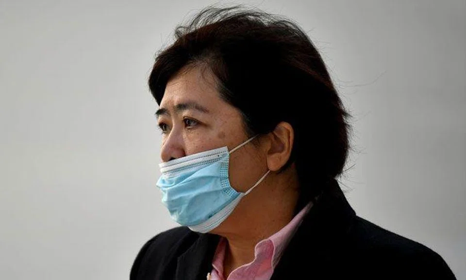 Phoon Chiu Yoke leaving the State Courts on June 15, 2021. She now faces a total of 22 charges. PHOTO: ST FILE