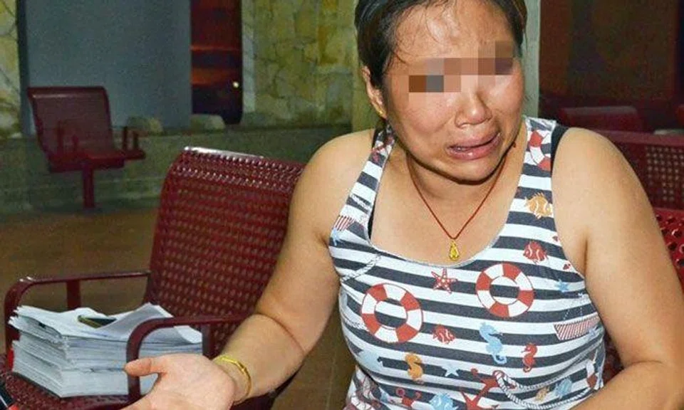 Ms Zhang (pictured) said she only wish to get back what rightfully belongs to her and the children. Photo: Shin Min Daily News