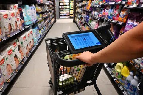 A demonstration of the Smart Cart helping a customer to navigate to the checkout area at FairPrice Punggol Digital District on Aug 27.