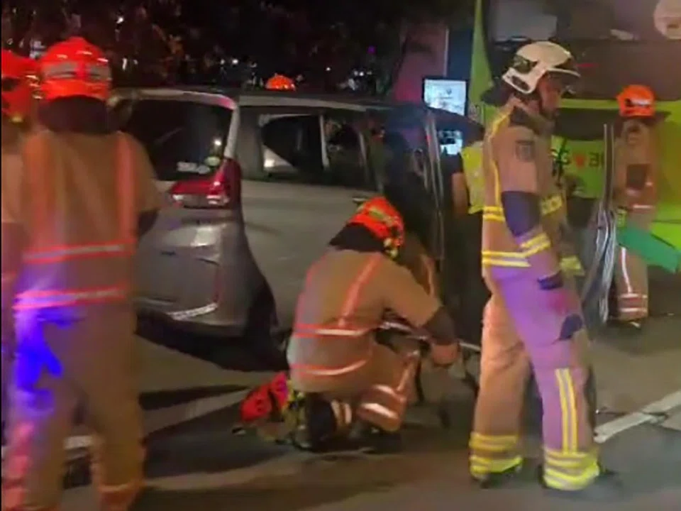 In photos of the accident, a silver car is seen crashed into the rear end of a Tower Transit bus.