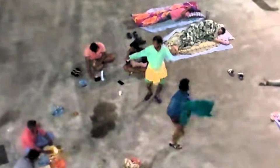 Migrant worker duo in world of their own as they perform sarong dance in Choa Chu Kang