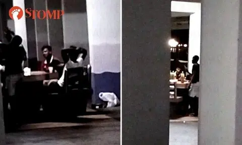 Taken furtively from behind the pillars in the void deck, the videos show about half a dozen men having a raucous time as they sat around a table with bottles on it. 