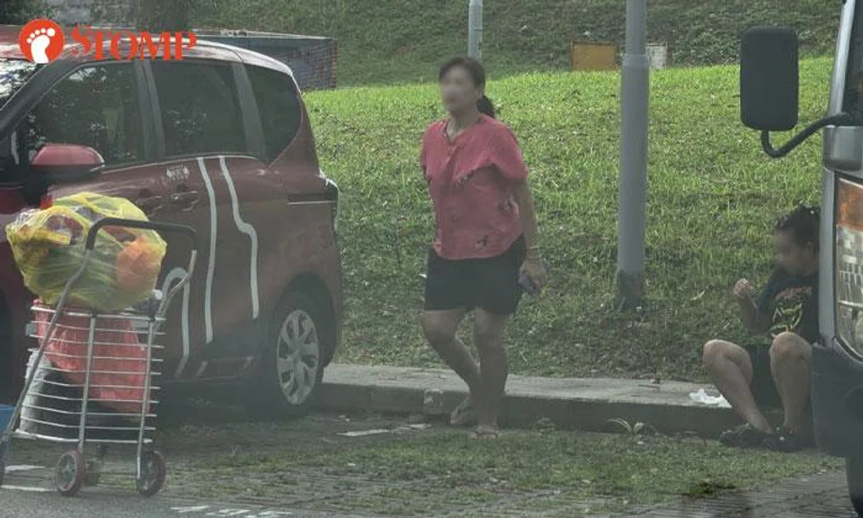women stand in lot at yishun carpark