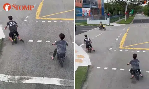 Youths ride PMDs in middle of the road at Marsiling Lane