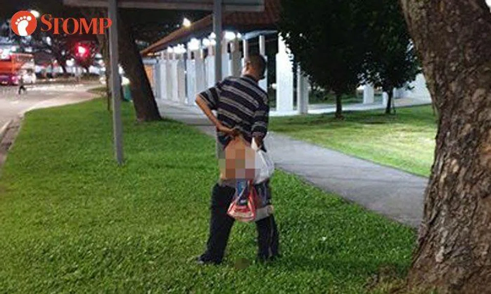 Man takes a dump on grass patch at Jurong West