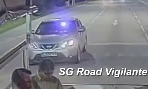 Nissan car straddles lanes while flashing blue beacon light: Is it allowed?
