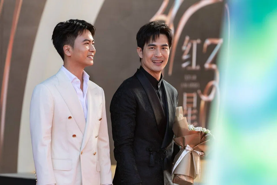 Actors Xu Bin (left) and Pierre Png walking the red carpet at the Star Awards ceremony at Mediacorp on July 6.