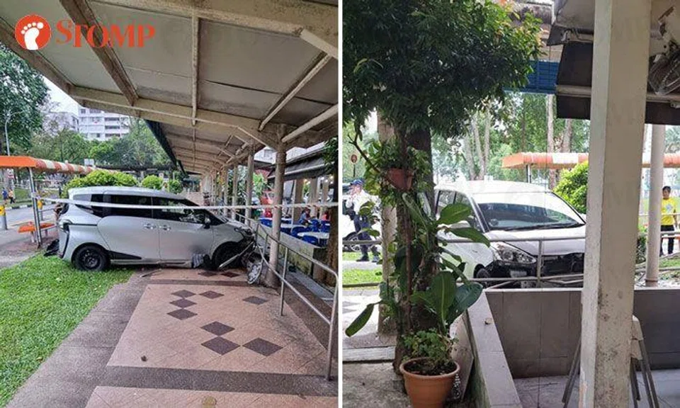 Car crashes into sheltered walkway after accident with taxi in Woodlands