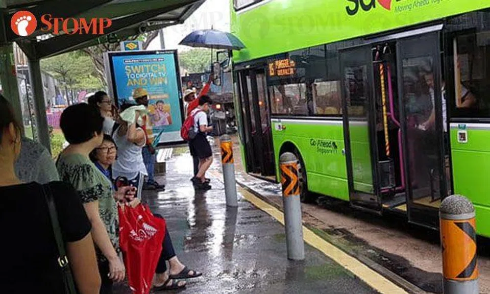 Foreign workers sacrifice break time to shield bus commuters from the ...