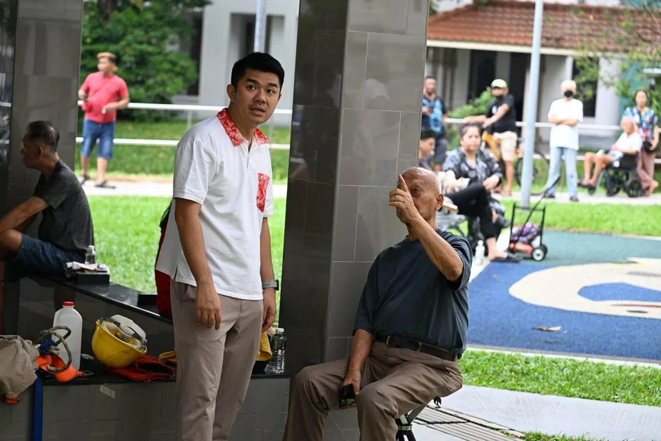 Bishan-Toa Payoh GRC MP Cai Yinzhou speaking to residents from the affected block, following a fire that broke out at Block 63, Lorong 5 Toa Payoh on Oct 6. 