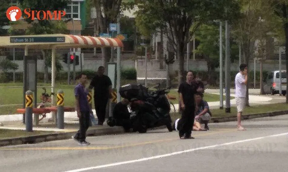 Woman hit by motorcycle while crossing road to reach bus stop in Yishun