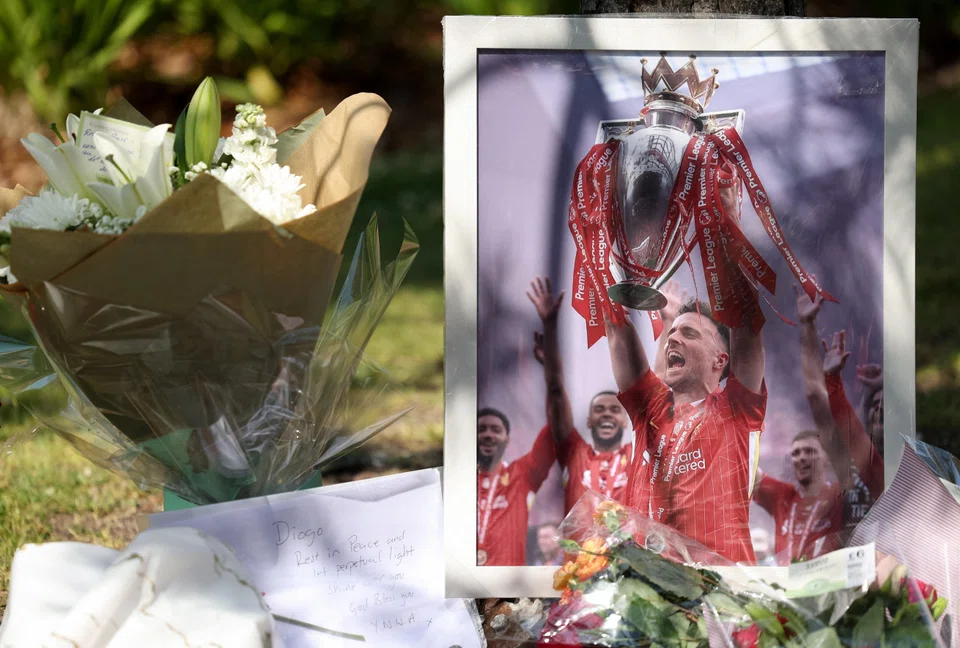 Flower tributes for Liverpool’s Portuguese footballer Diogo Jota outside Anfield Stadium in Liverpool on July 3.