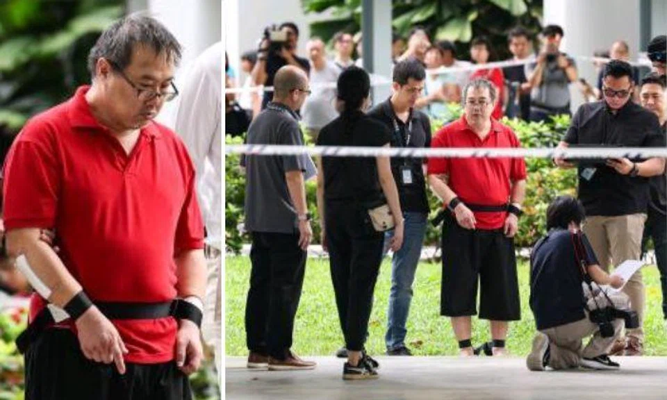 Surrounded by five police officers, Toh Chee Hong, 50, arrived at Block 311C Clementi Avenue 4 at around 10.20am. Photo: The Straits Times