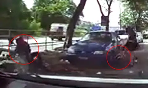 Woman absolutely clobbers two thieves who try to snatch her handbag in Malaysia