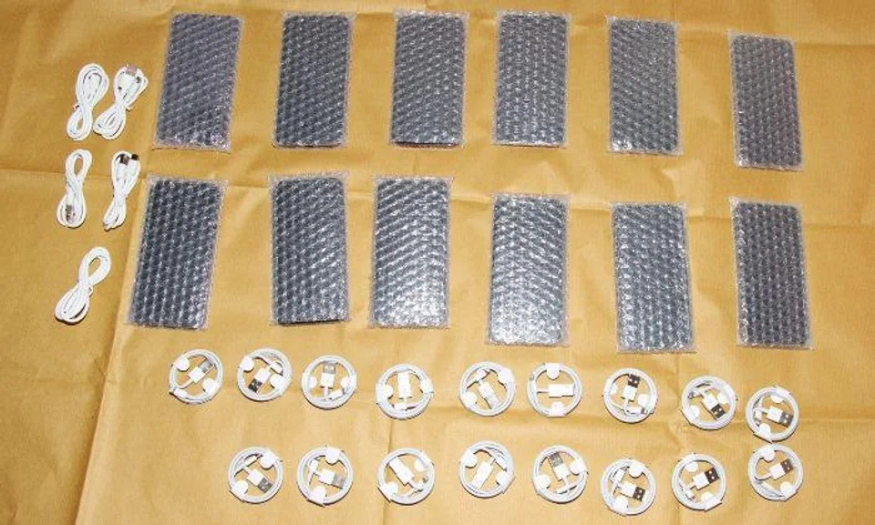 Several mobile phones and accessories that were purportedly counterfeit, fake invoices and cash amounting to about $1,440 were seized.