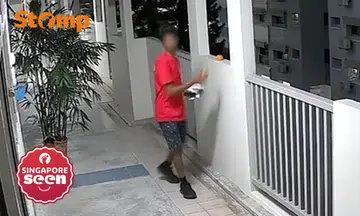 Man distributing flyers takes orange left outside Woodlands flat: 'Not your things, don't touch'