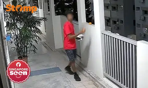 Man distributing flyers takes orange left outside Woodlands flat: 'Not your things, don't touch'