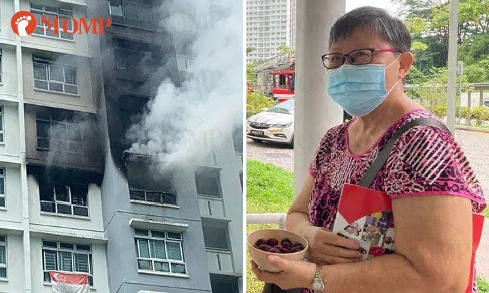 The fire broke out in a flat on the 11th floor. Madam Doreen Ong rushed up to her 19th-floor studio apartment to save her blind husband. PHOTOS: LIANHE ZAOBAO READER, STOMP