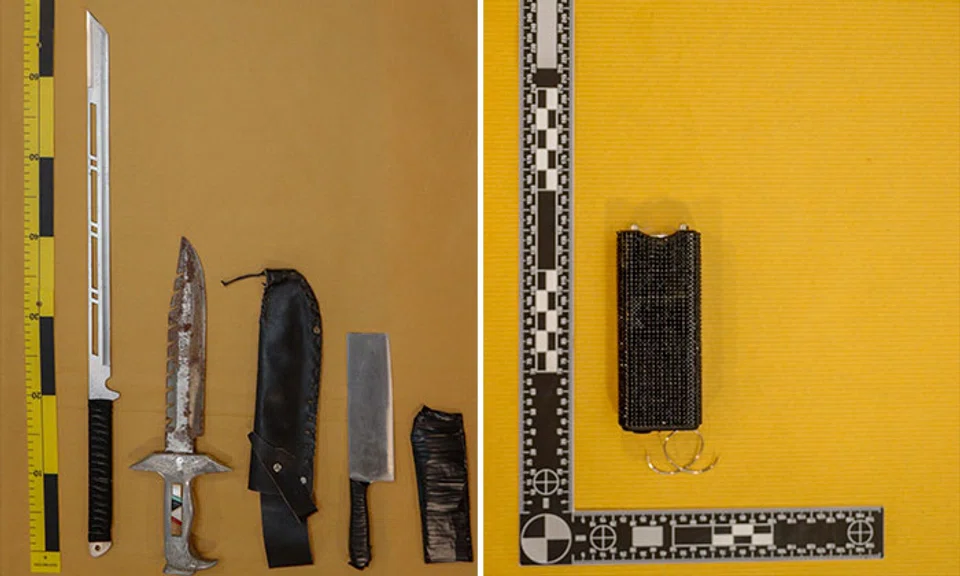 Weapons seized by the police included a samurai sword, two knuckledusters and the stun device. PHOTOS: SPF