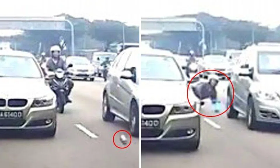 Bouncing debris on road sends motorcyclist crashing to the road on PIE