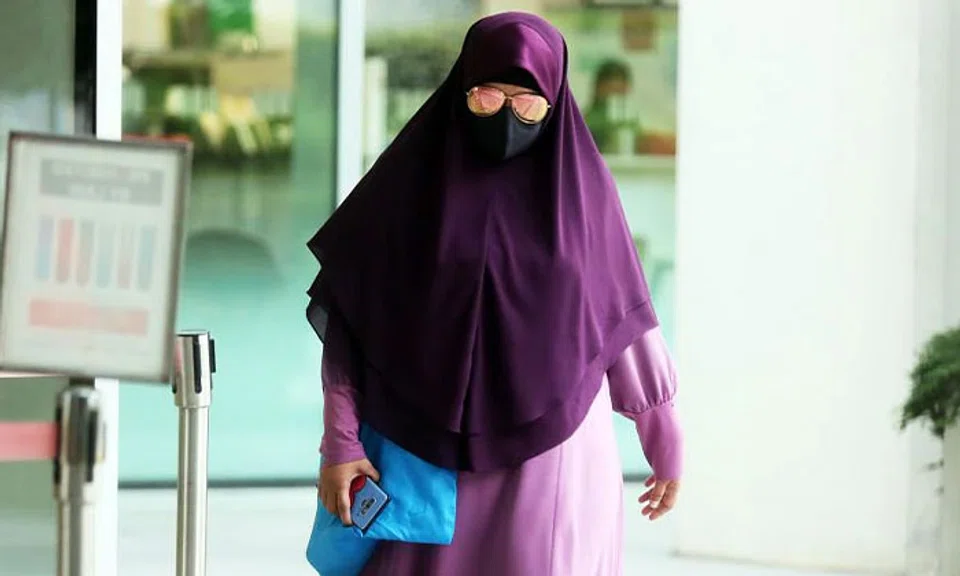 Ummi Kalsum Ali abused her Indonesian domestic helper by punching her repeatedly and using a clothes hanger to hit her eyes. ST PHOTO: KELVIN CHNG