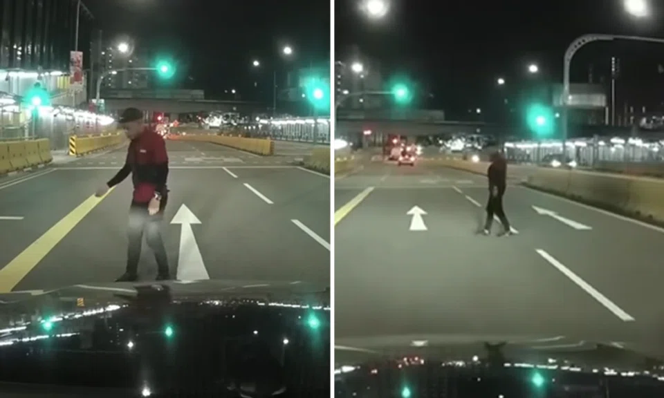 man standing in front of oncoming traffic