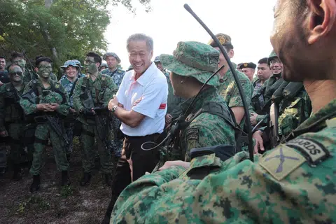 Defence Minister Ng Eng Hen (in white) visiting operationally ready national servicemen from 702 Guards participating in Exercise Golden Sand at Pulau Sudong on April 24, 2014.