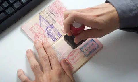 KLIA immigration officer caught sleeping on the job -- with 12 passports tucked into his waistband