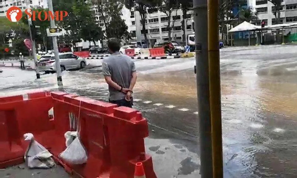 Burst pipe causes water to gush down South Woodlands Drive