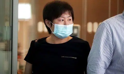 Zhao Lin leaving State Courts on Dec 14, 2021. ST PHOTO: KELVIN CHNG