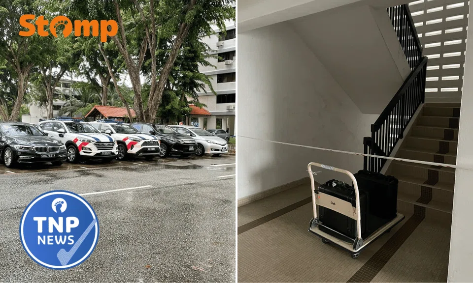 The 13th floor was cordoned off, and police cars were seen in the carpark.