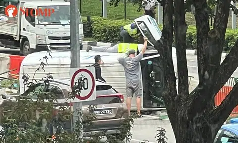 Driver taken to hospital after van overturns in accident at Alexandra Road