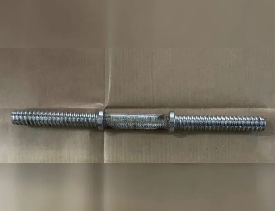 The metal rod that was seized as a case exhibit by police when the armed robbery suspect was arrested.