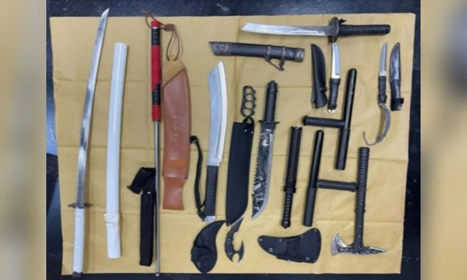 CNB seized an assortment of narcotics worth around $118,000 and weapons including an airsoft pistol, machetes and swords. Photo: Central Narcotics Bureau