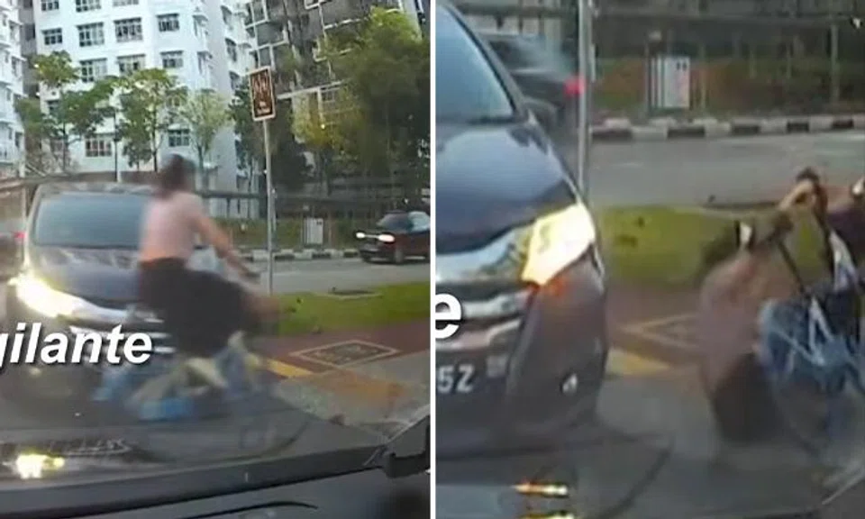 A female cyclist was knocked down by a car.