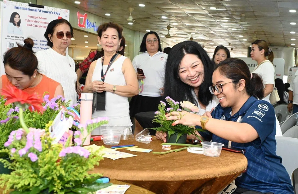 Pasir Ris-Punggol GRC MP Yeo Wan Ling (second from right) mingled with residents at an event marking International Women’s Day outside Koufu at Punggol Plaza.